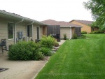 Beautiful landscaping with privacy fence on patio.  