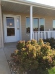 nice front picture of covered porch at woodridge.jpg